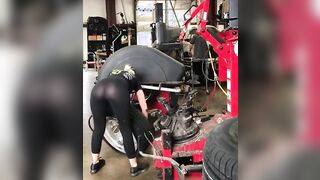 Doing something to a tire.