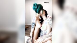 passionate kisses of a tattooed lesbian couple